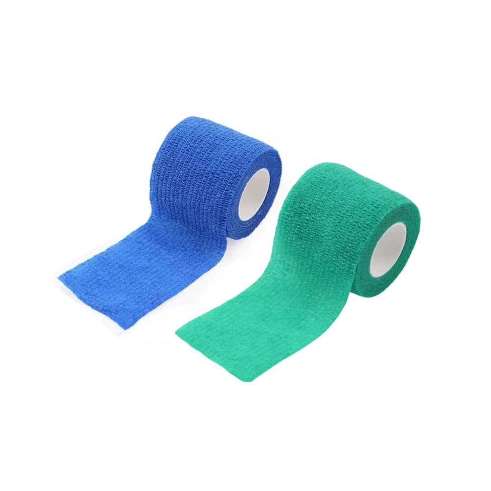Two rolls of cohesive tattoo grip wrap, one blue and one green, on a white background